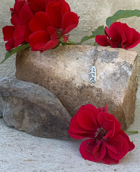 Tiny sterling silver leaf necklace.